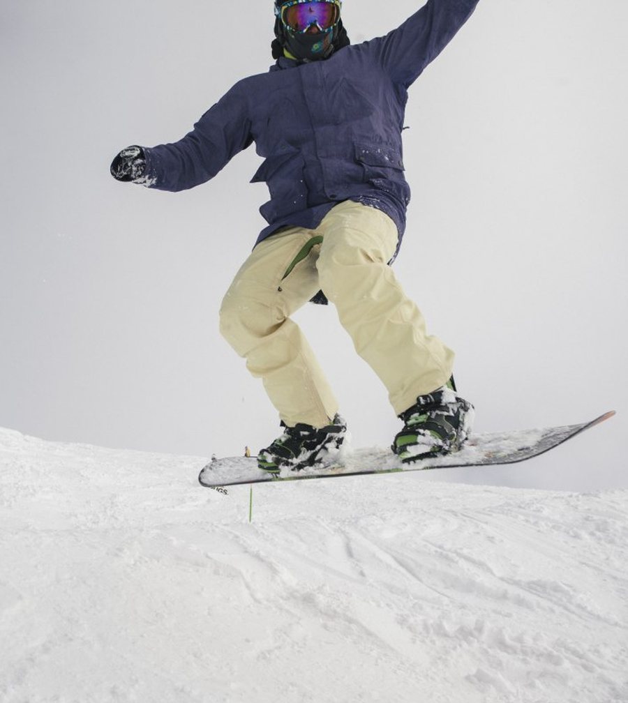 Stan Kosarev, co-founder, mid-air on his snowboard